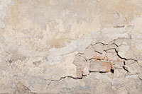 Stucco patching on a plastered wall
