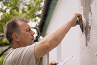 stucco water damage repair on home